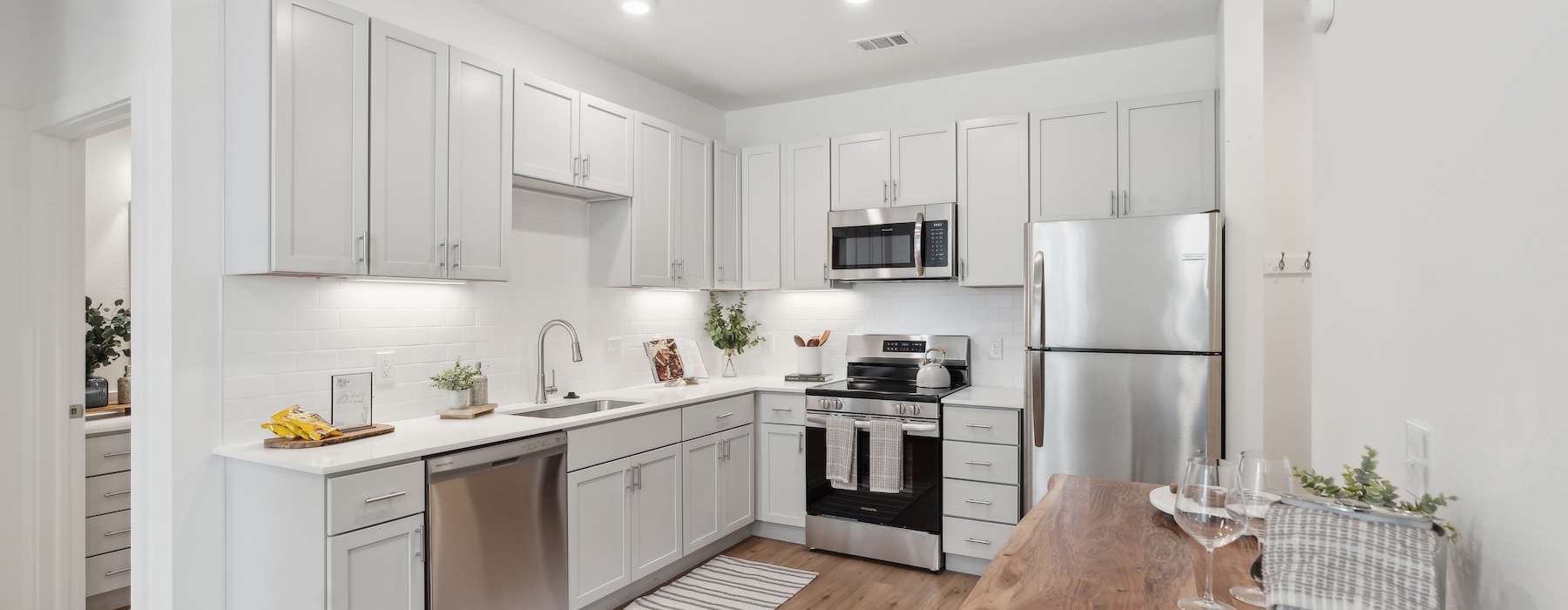 a kitchen with white cabinets