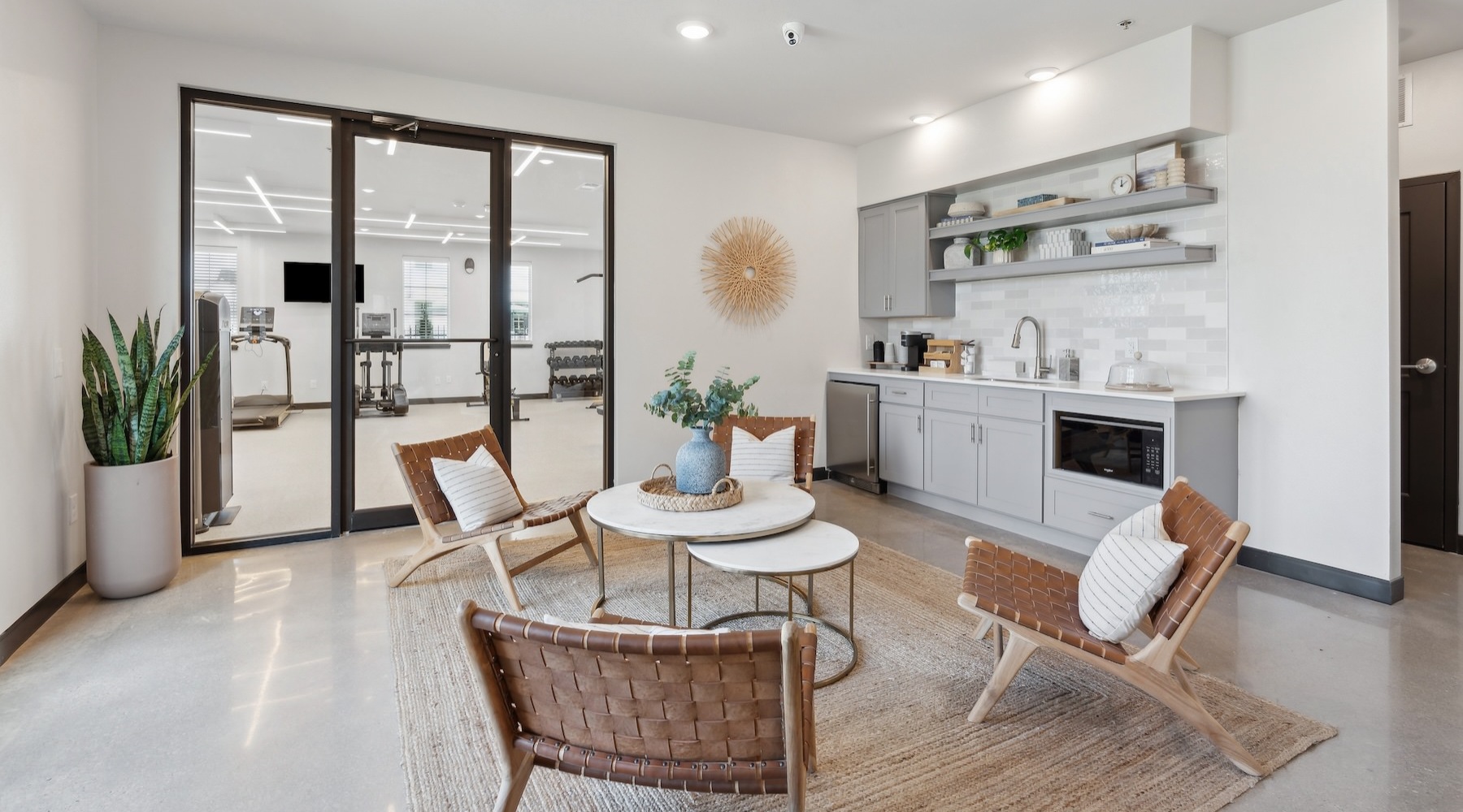 a community kitchen with a table and chairs